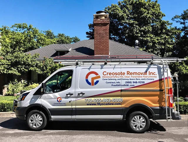 Wayland Chimney Sweep technician removing creosote safely in Wayland, MA