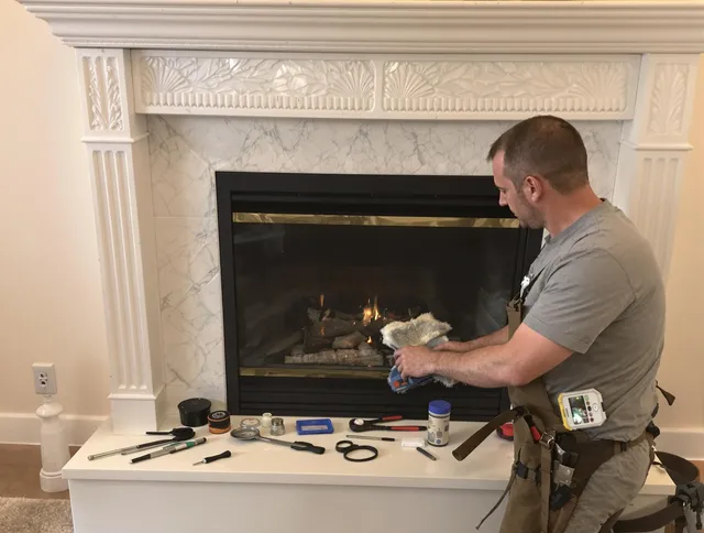 Wayland Chimney Sweep performing fireplace maintenance in Wayland, MA
